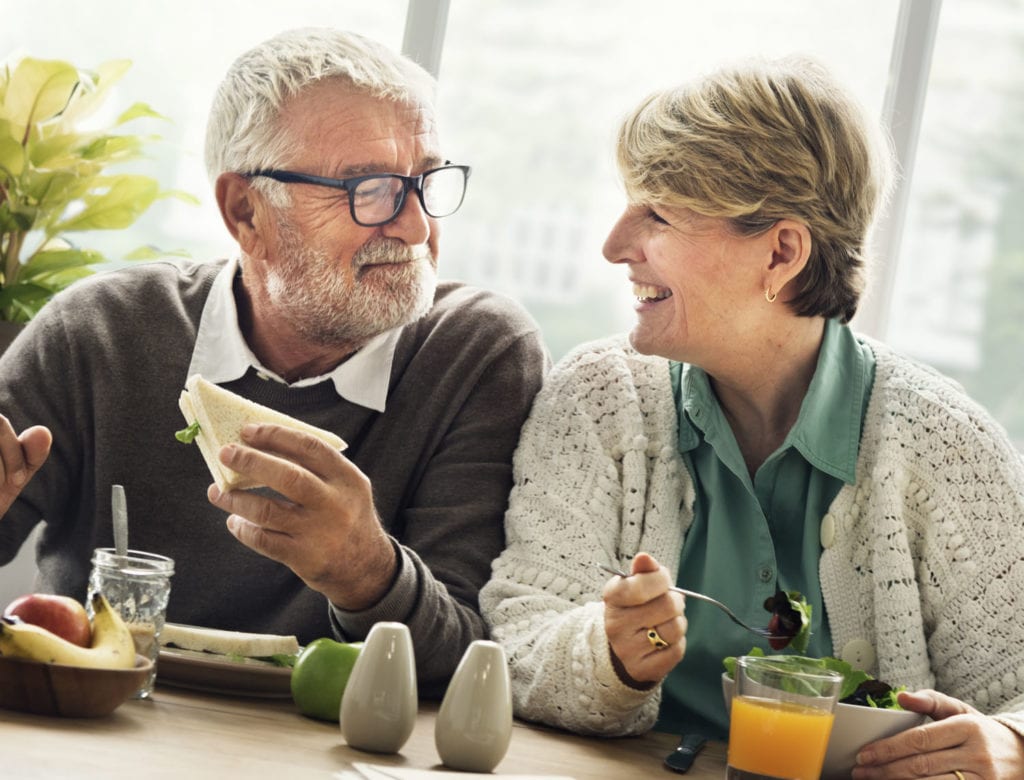 Elderly couple enjoying lunch together