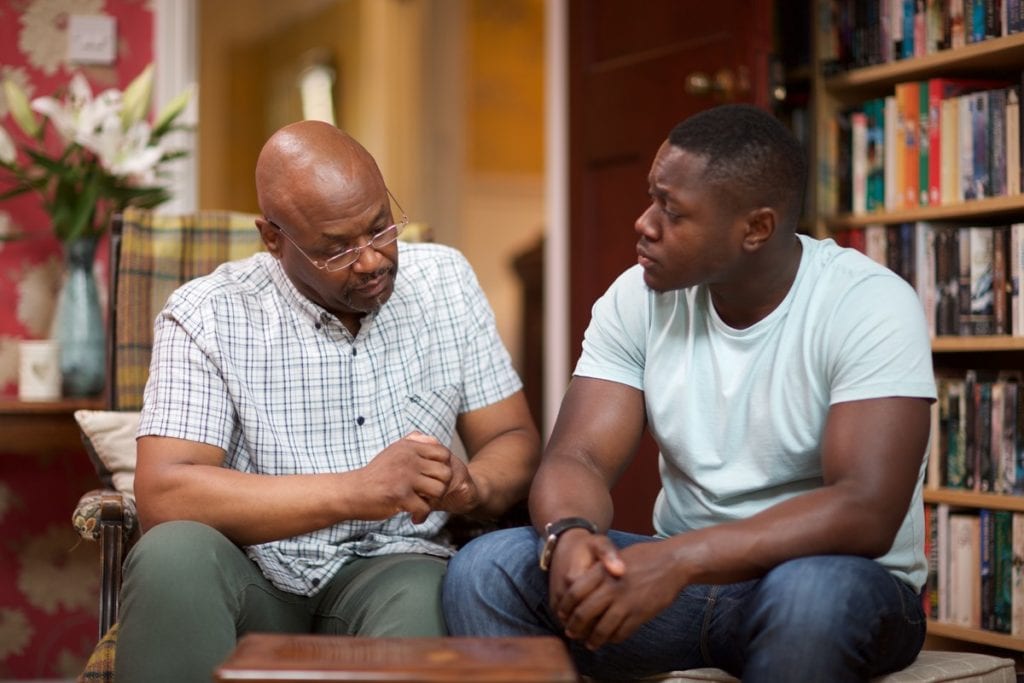 Father talking to his adult son