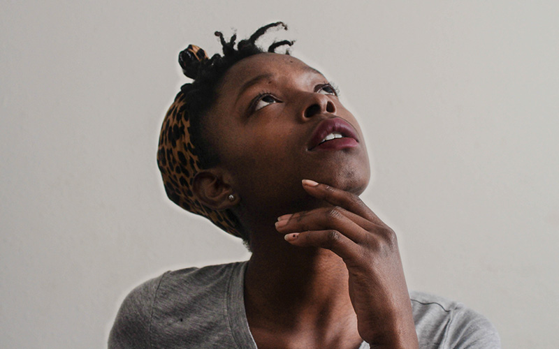 A woman looking upwards inquisitively.