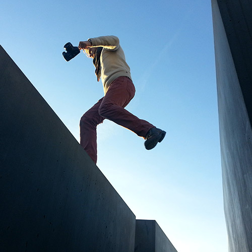 closing-your-retirement-savings-gap-500x500 A man holding a camera, jumping over a small gap.