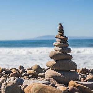 A stack of balancing pebbles on a beach