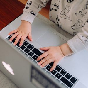 A young child using a laptop