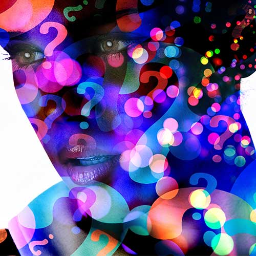 A womans face covered by luminescent question marks.