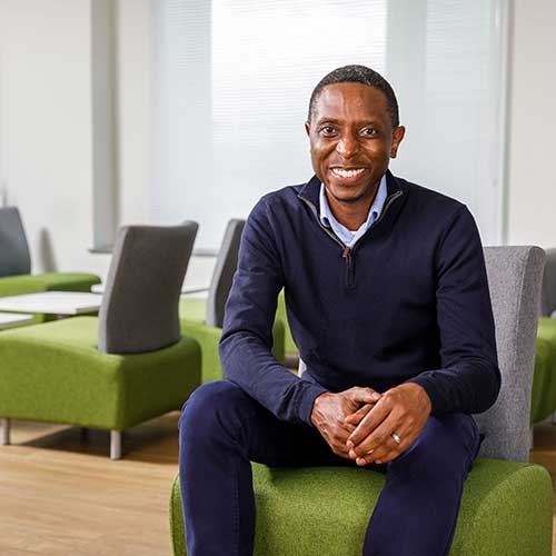 having-you-as-part-of-our-family-500x500 OneFamily CEO Teddy Nyahasha, sitting in the OneFamily offices