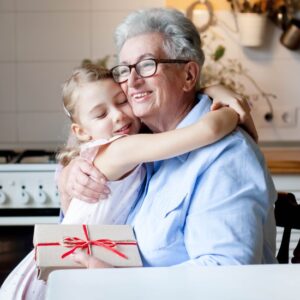 Young girl hugging grandparent