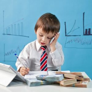 Child wearing a tie talking on the phone
