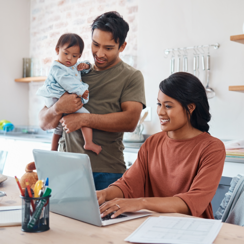 Family looking at a laptop