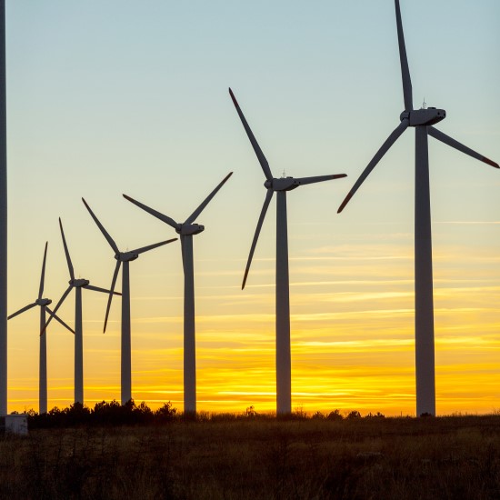 Wind turbines with sunset behind