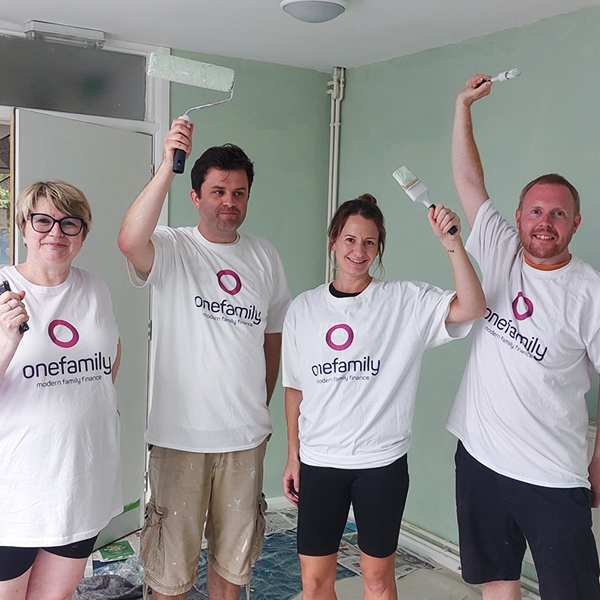 volunteering 2023 Sara, Tom, Gemma and Olly holding up paintbrushes