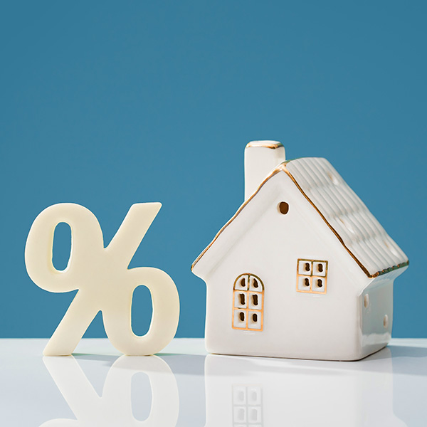 Percentage,And,House,On,White,Desk.,Mortgage,Calculator,Or,Real Percentage and house on white desk. mortgage calculator or real estate business concept banner. Listing. Down payment. Loan or insurance rate payments. Liability and risk