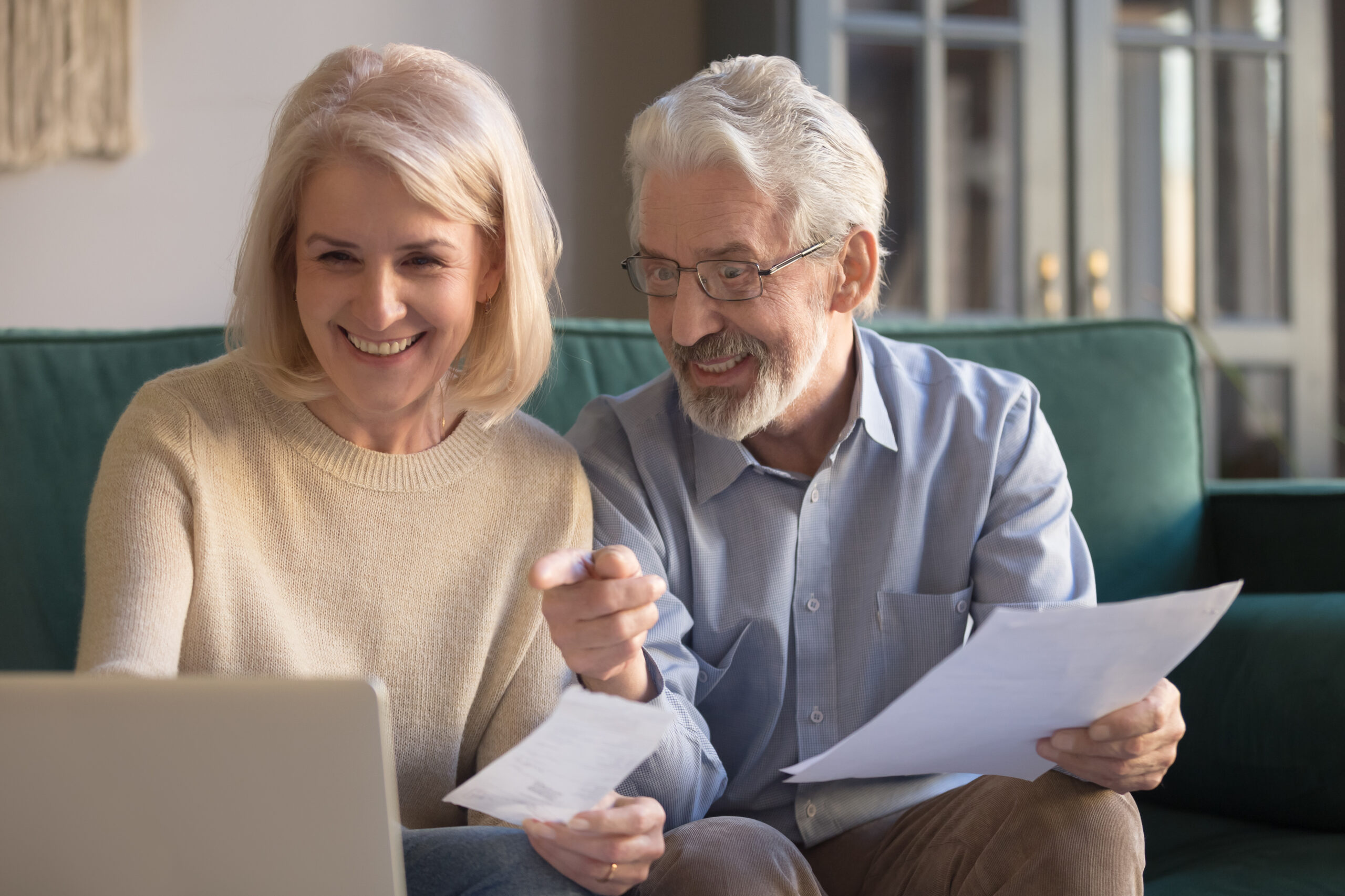 Happy,Old,Retired,Couple,Paying,Domestic,Bills,Online,Using,Computer