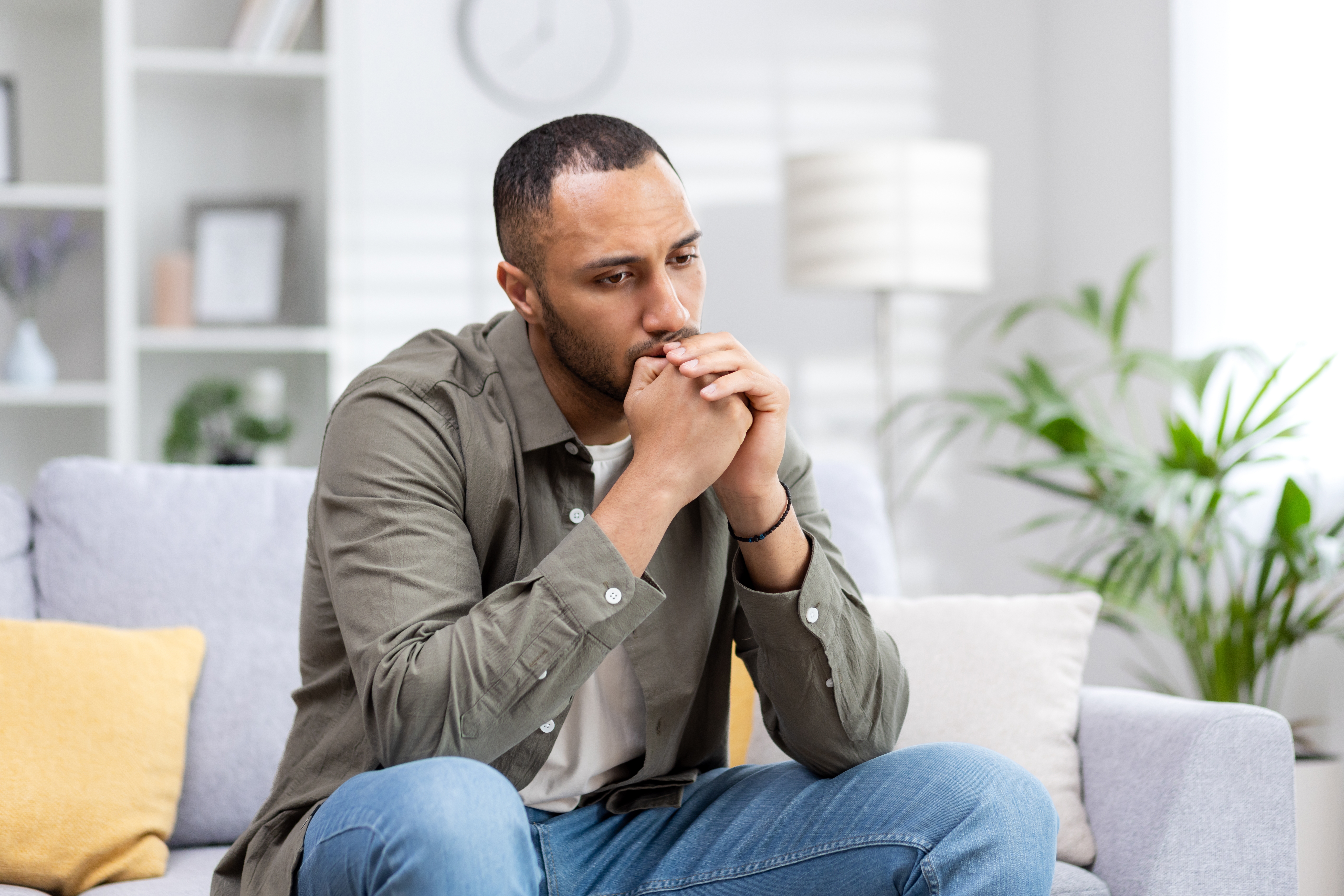 Depression,In,A,Young,Latin,American,Man,Sitting,Thoughtfully,And