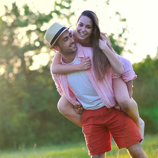 A man giving his partner a piggy-back