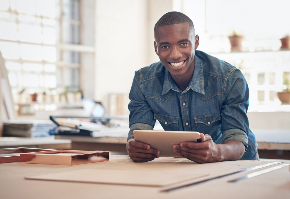 black man in studio with tablet