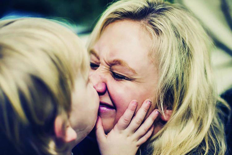 Mother and child rubbing noses.